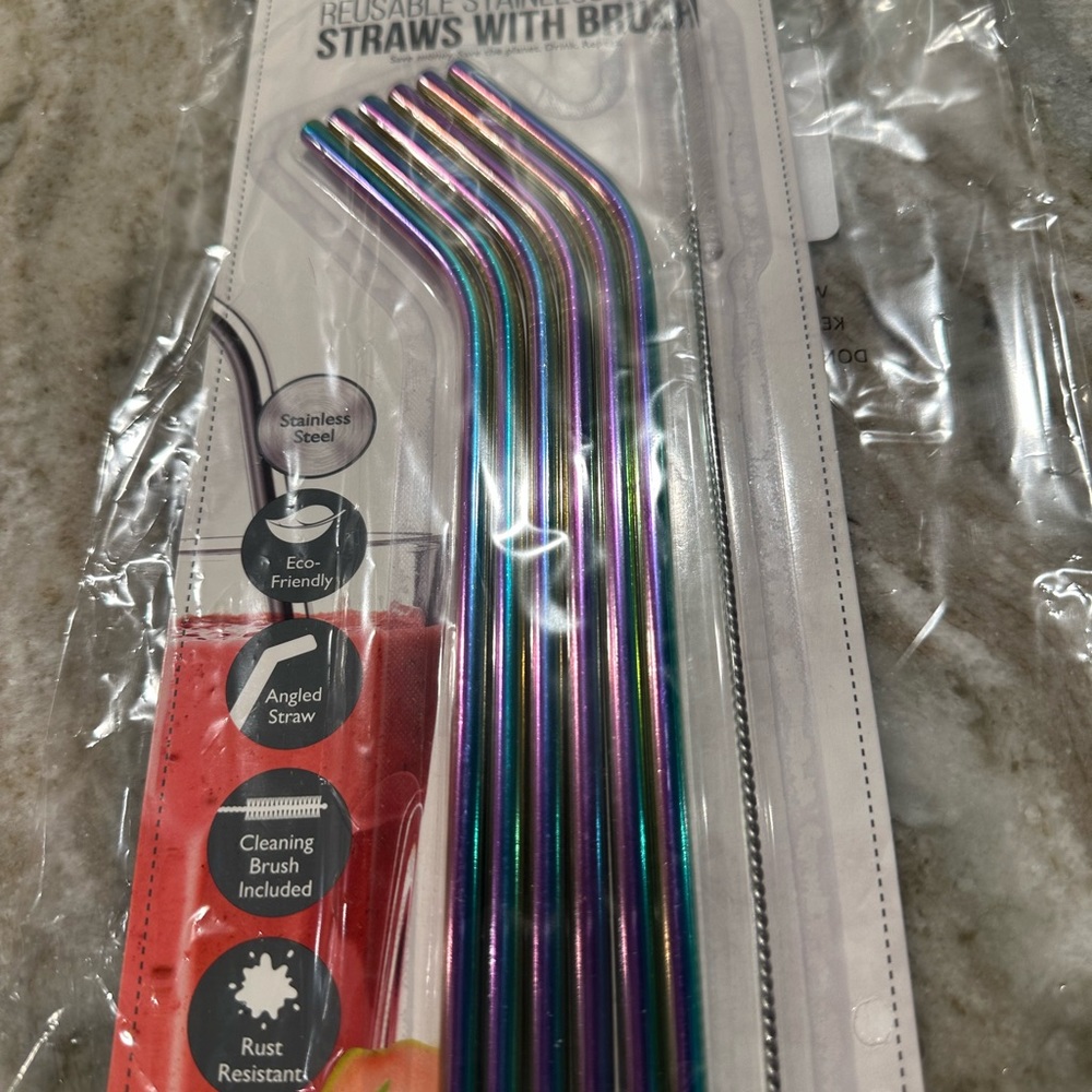 Stainless steel straws with straw covers and cleaning brush.
